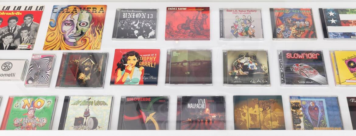Photo of record jackets and CD cases.