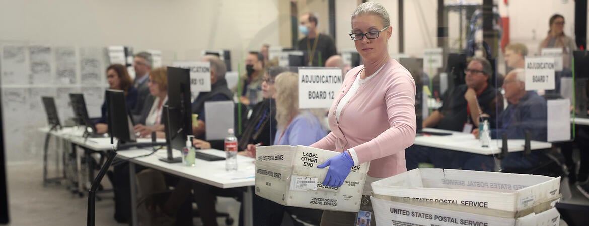 Election workers process ballots
