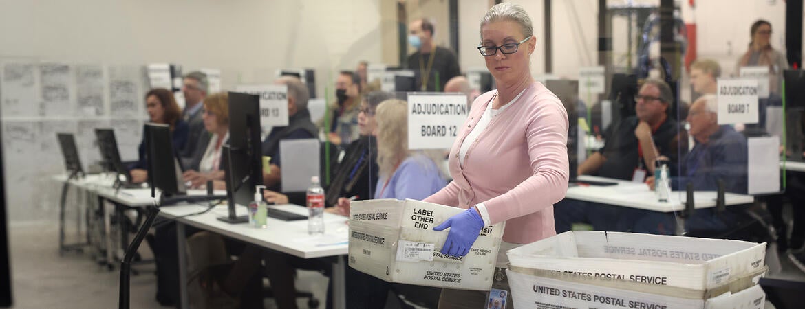 Election workers process ballots