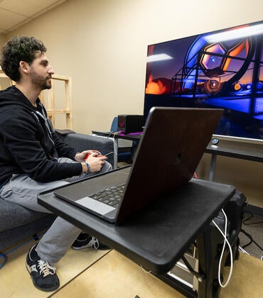 Ethan Castro, co-founder and CTE of EDGE Sound Research, works in his Riverside lab on Thursday, February 2, 2023. (UCR/Stan Lim)