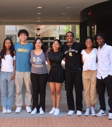 Black engineering students standing outside taking group photo
