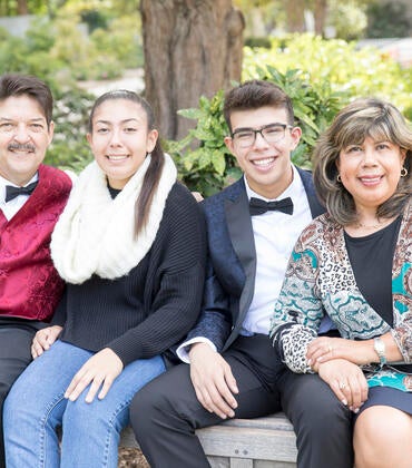 Joshua Tejada with his parents and sister.