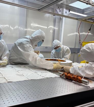 Students disassemble an instrument