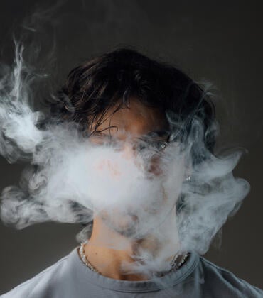 Man vapes