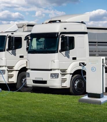 EV trucks at charging stations