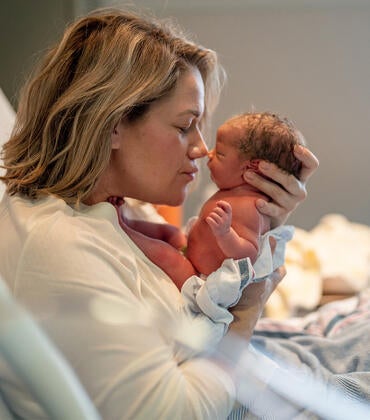 Mother with newborn baby in hospital
