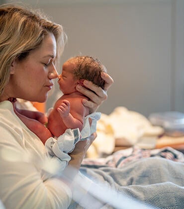 Mother with newborn baby in hospital