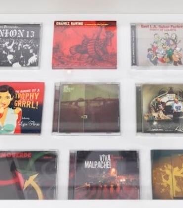 Photo of record jackets and CD cases.