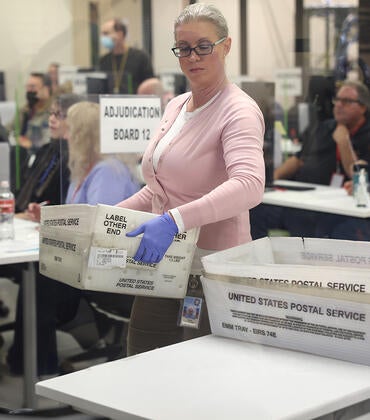 Election workers process ballots