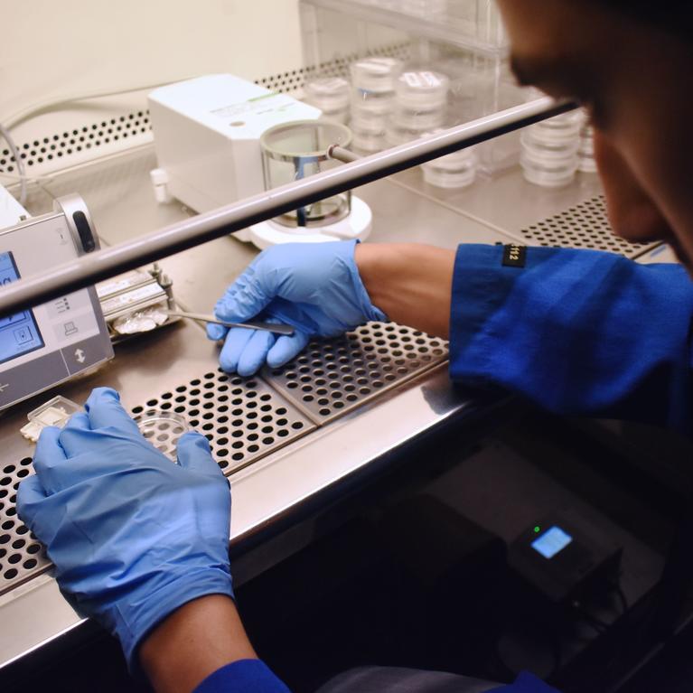 UC Riverside chemical and environmental engineering graduate student Anthony Gerigk weighs the final mass of emissions on a teflon filter.