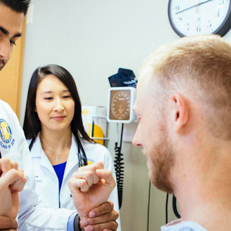 UC Riverside medical students treat a patient 