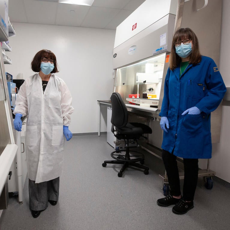 Isgouhi Kaloshian, Professor and Chair of the Department of Nematology, left, Katherine A. Borkovich, Professor and Chair, Department of Microbiology and Plant Pathology inside a COVID-19 testing lab 