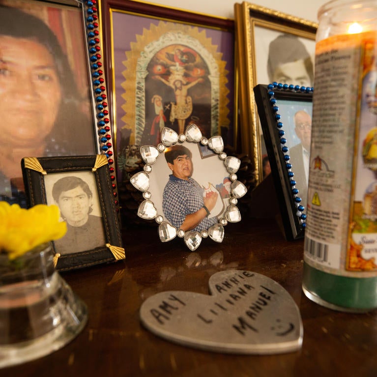 A photo of Manuel Villanueva, center, sits among other family photos as part of a memorial at his families home in Reseda