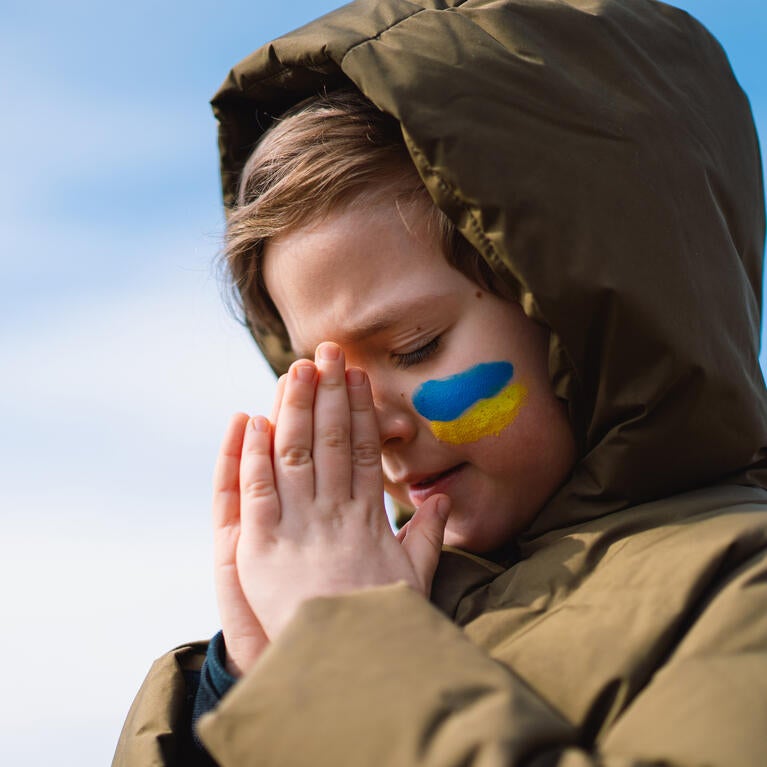 Ukrainian boy praying