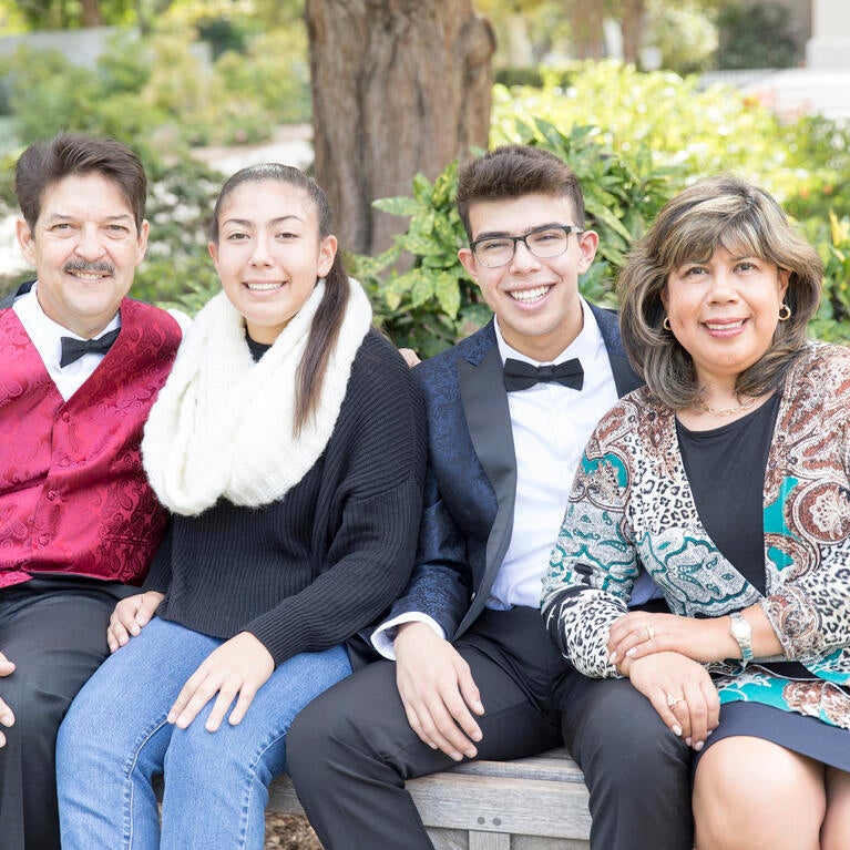 Joshua Tejada with his parents and sister.