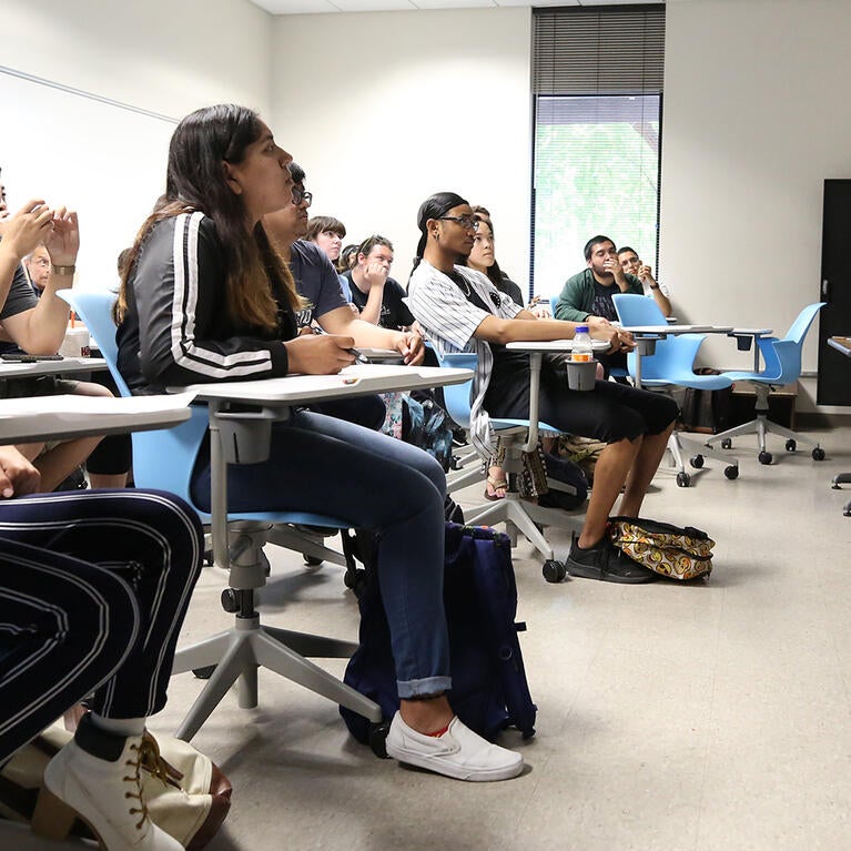 A student presents to a class at UC Riverside