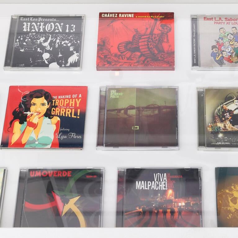 Photo of record jackets and CD cases.