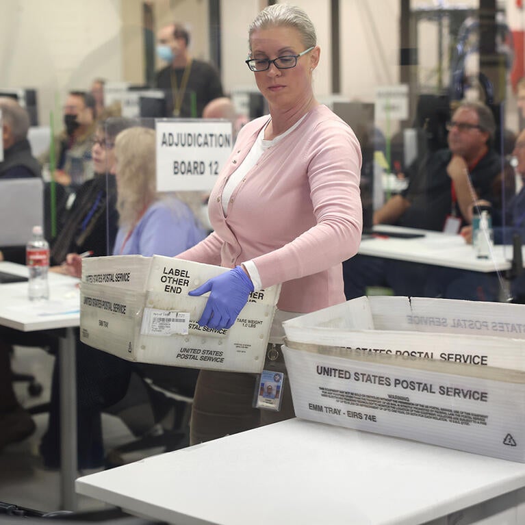 Election workers process ballots