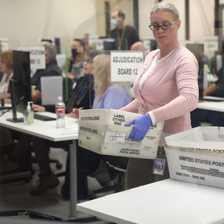 Election workers process ballots