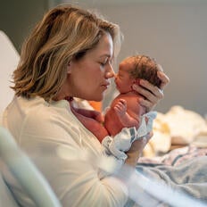 Mother with newborn baby in hospital