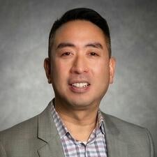 A headshot of David Tsai