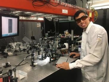 vicente robles with the setup he uses to perform optical cavitation experiments