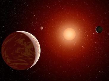 Artist rendering of a red dwarf or M star, with three exoplanets orbiting. About 75 percent of all stars in the sky are the cooler, smaller red dwarfs. IMAGE CREDIT: NASA.