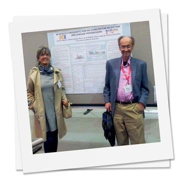 Gloria Gonzalez-Rivera with Dimitrios Morikis stand next to their poster at the Biomedical Engineering Society annual meeting in Seattle, 2013
