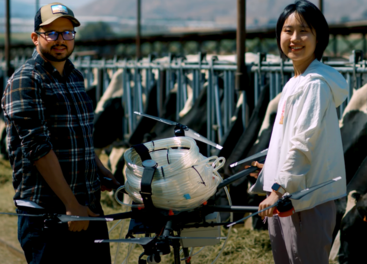 Researchers hold a drone used to take air samples