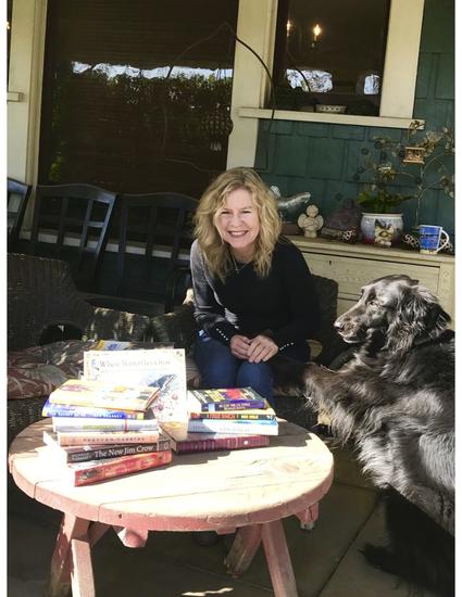 Susan Straight on her front porch with her dog, Angel.
