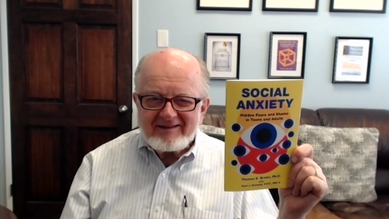 Thomas Brown with his book on social anxiety