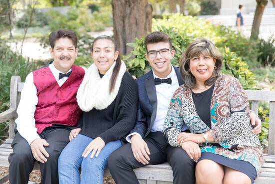 Joshua Tejada with his parents and sister.