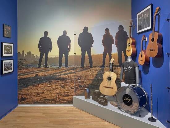 Photo of instruments played by Los Lobos and an artistic image of the band.