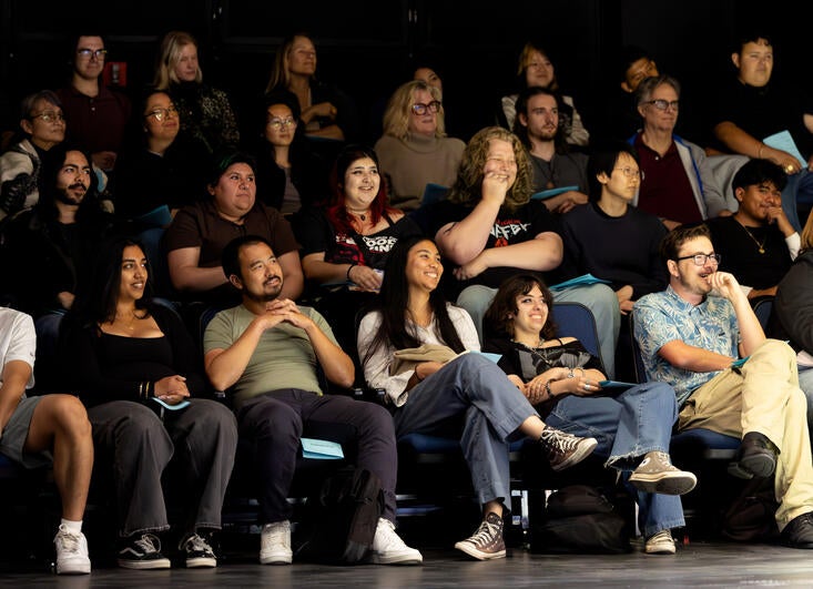 Audience members reacting to stage readings
