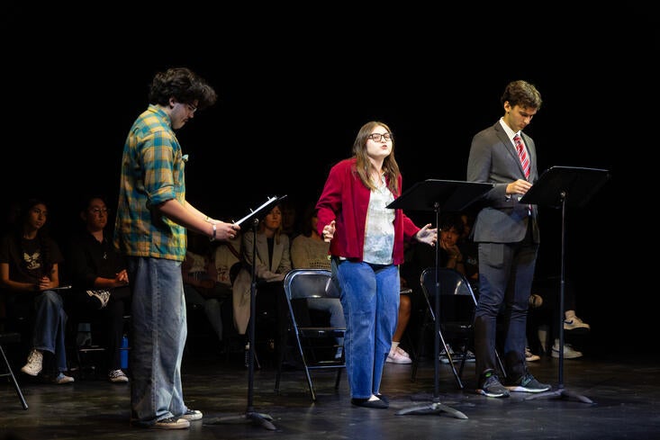 Actors performing a stage reading