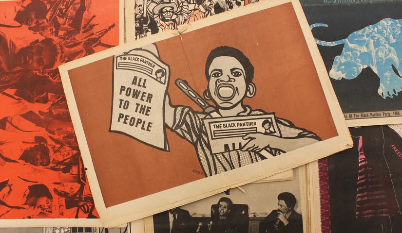 Image of artwork by Emory Douglas featuring a boy holding a paper that reads "All Power to the People". Photo by Essence Harden. Archives of Southern California Library