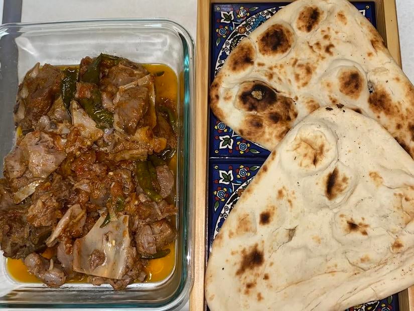 Chicken karahi, served with warm naan. (Photo courtesy of Zaynah Waseem)