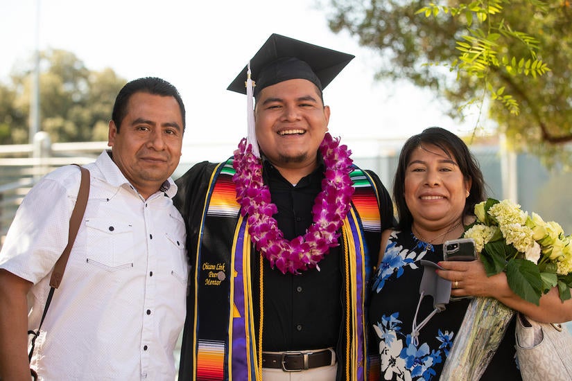 Juan Morales with his parents, Lucio Morales and Rosa Pascual, on Monday, June 14, 2021. (UCR/Stan Lim)