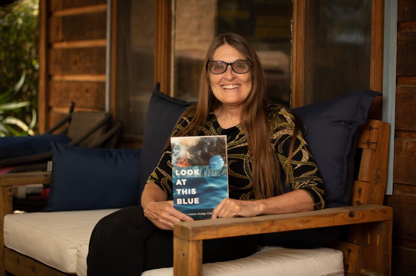 Allison Adelle Hedge Coke holding her new book of poetry, "Look at This Blue." (UCR/Stan Lim)