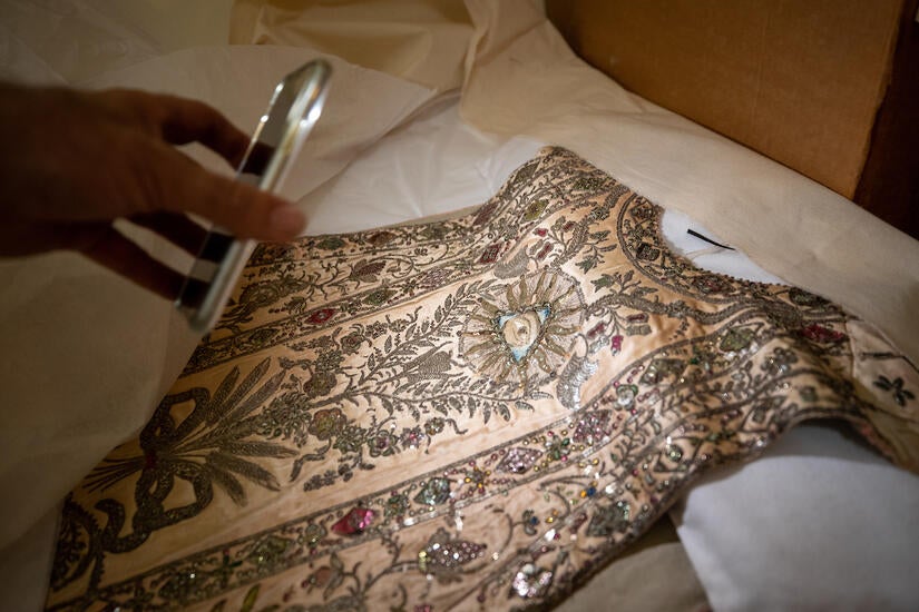 The exhibition includes a 1770s silk beaded, rose-colored chasuble woven in China and designed in Mexico by liturgical authorities — likely worn by St. Junípero Serra during one of his visits to the mission. (UCR/Stan Lim)