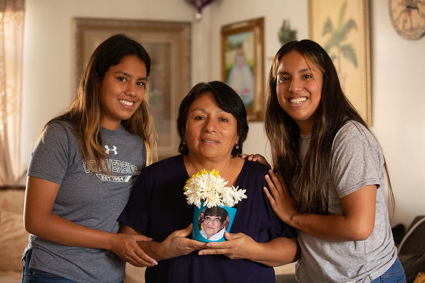 Amy Villanueva, left, 23, and her twin sister, Annie, right, pose for a portrait with their mother Liliana Monteza, at their home