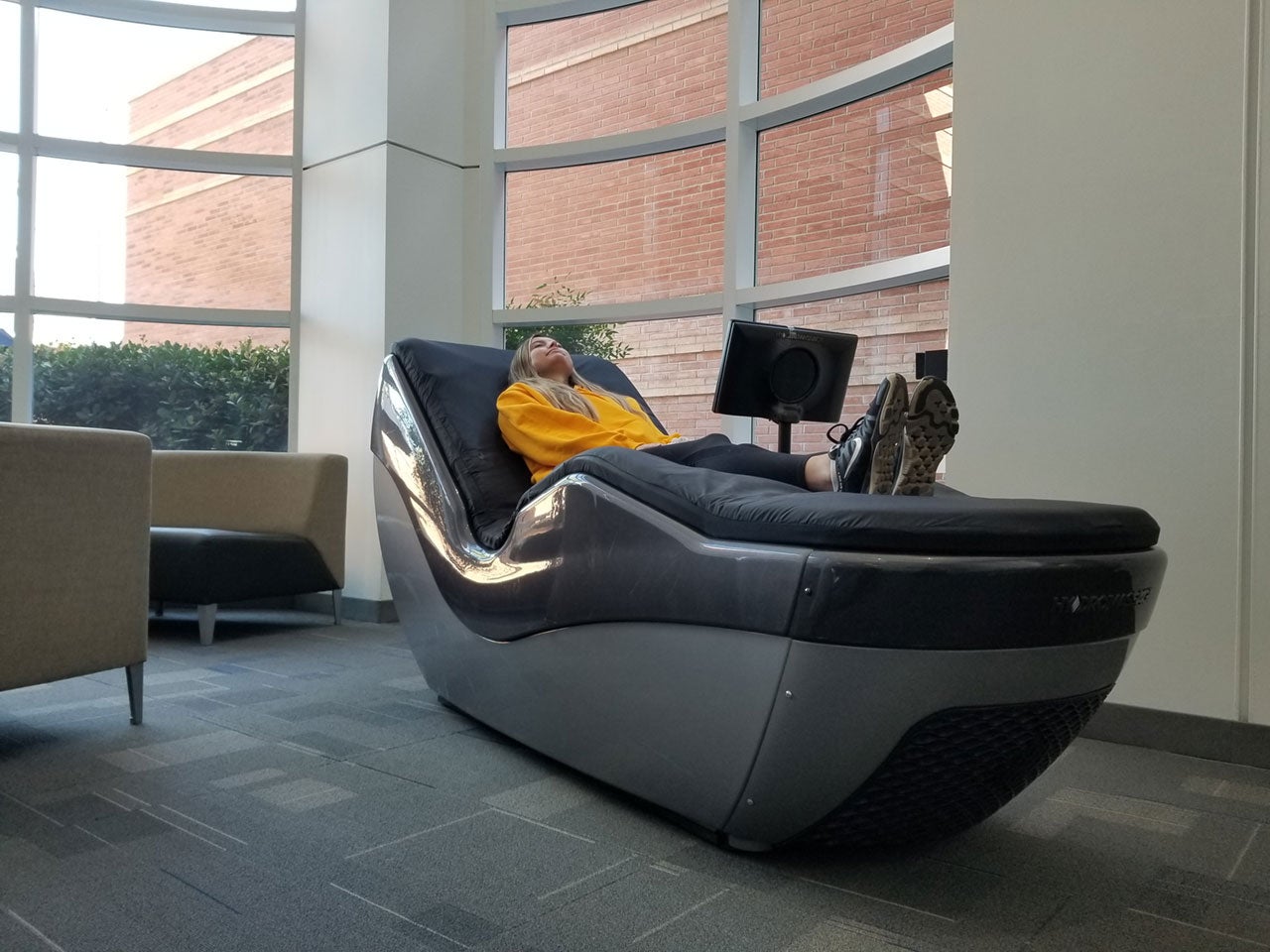 SRC student worker uses hydro massage chair.