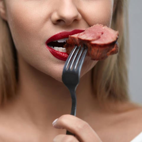lady eating meat