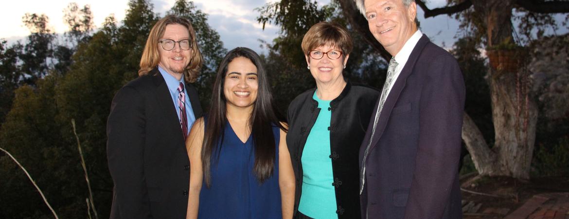 UCR Graduate School of Education Dean Thomas Smith with UCR-RUSD Pipeline Scholarship recipient Maria Hernandez and scholarship fund creators Kathy and John Allavie.