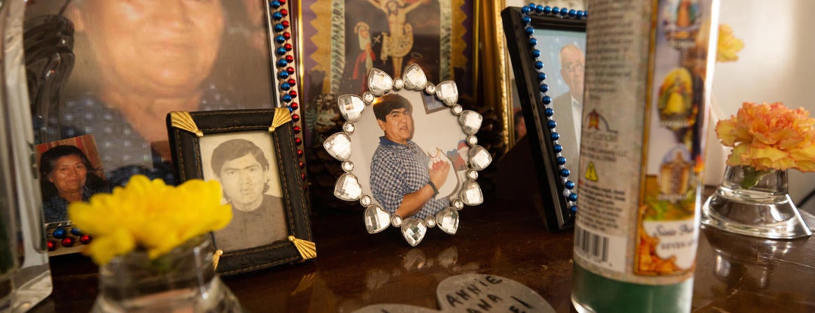 A photo of Manuel Villanueva, center, sits among other family photos as part of a memorial at his families home in Reseda