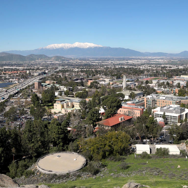 A view overlooking UC Riverside with snow-covered Mt. Baldy in the distance
