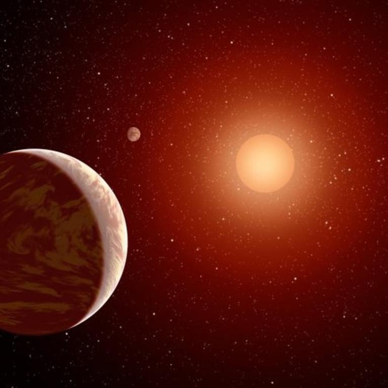 Artist rendering of a red dwarf or M star, with three exoplanets orbiting. About 75 percent of all stars in the sky are the cooler, smaller red dwarfs. IMAGE CREDIT: NASA.
