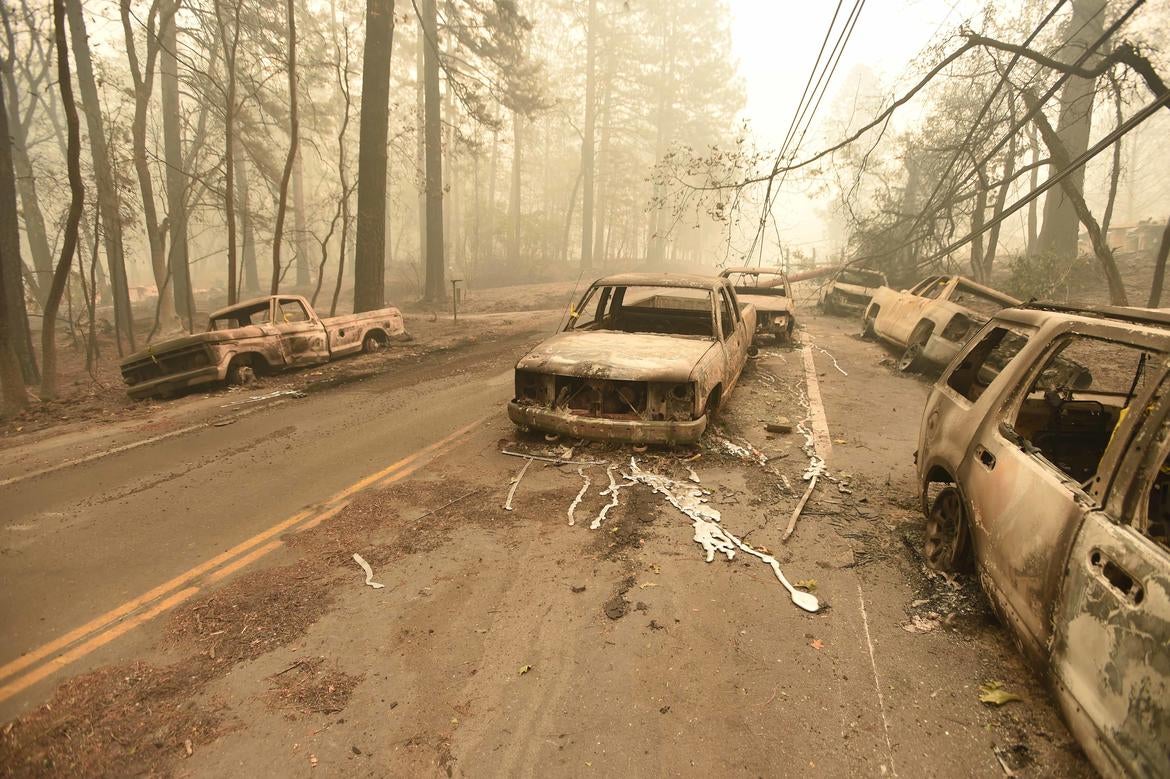 Josh Edelson, "Fallen power lines on burned vehicles, Paradise, California; Camp Fire, November 10, 2018" (Courtesy of Josh Edelson/AFP/Getty Images)