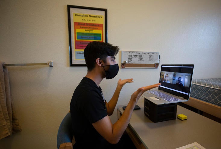 RA Thomas Valenzuela chats with Prabhnoor Kaur during a virtual check-in. (UCR/Stan Lim)