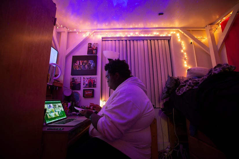 Killian Andrews, 18, interacts with residential advisor Thomas Valenzuela and other students through Zoom, in his room at Pentland Hills Residence Hall on October 12, 2020. (UCR/Stan Lim) 